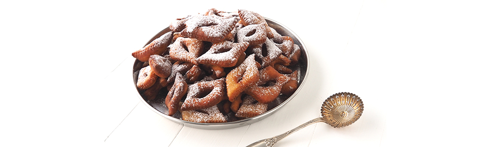 Présentation des bugnes de carnaval dans un moule à tarte en inox 18/10